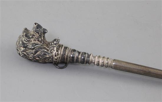 A Victorian novelty silver buttonhook, the terminal modelled as the head of a dog, 30.2cm.